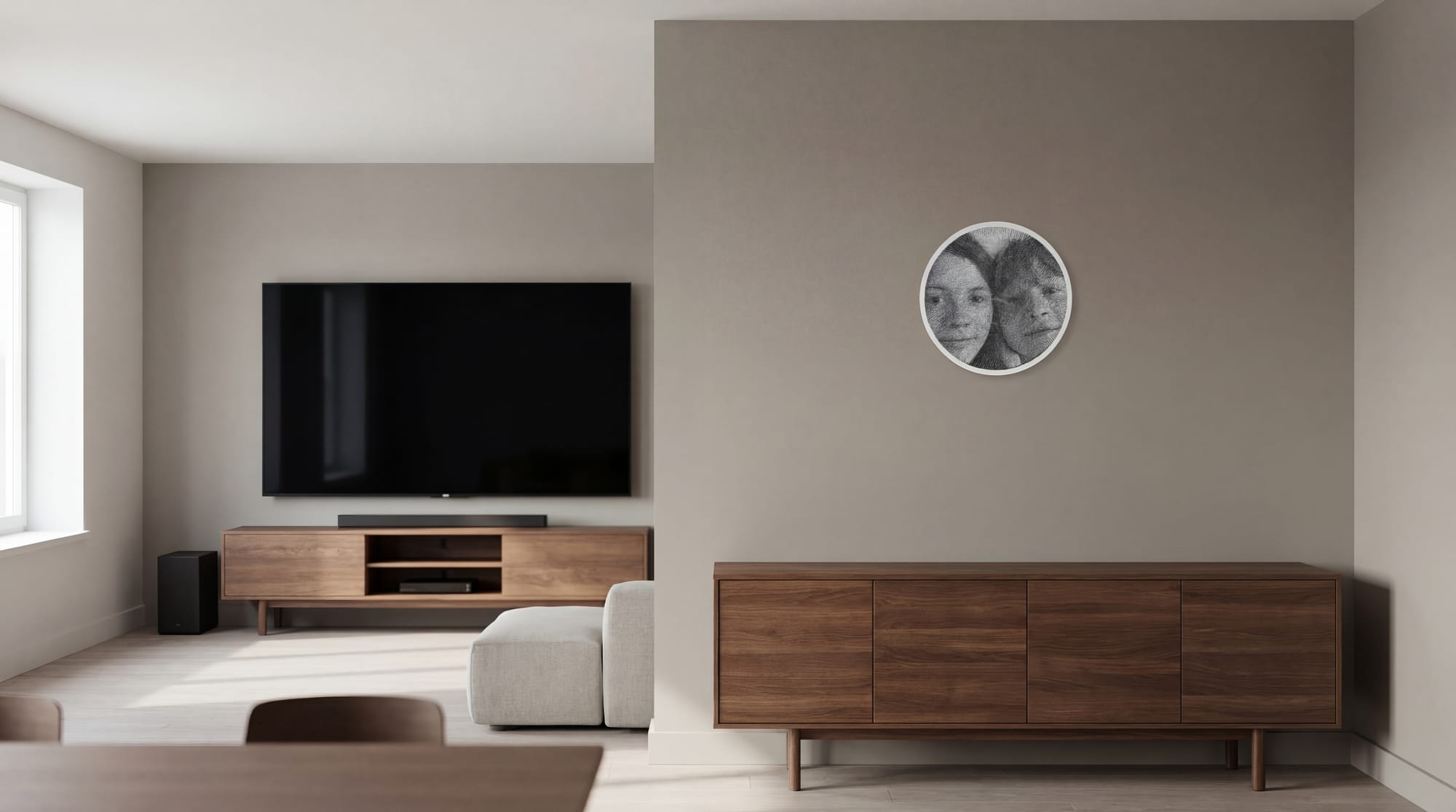 Small round string art portrait mounted on a side wall near a TV and wooden cabinet.