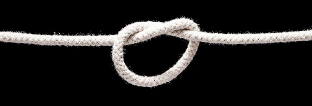 Single knot in white cord